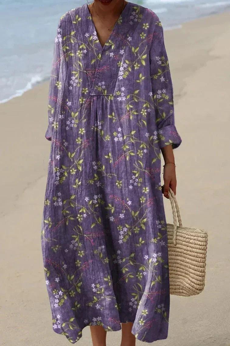 Violet floral midi dress with V-neck, long sleeves, and gathered waist