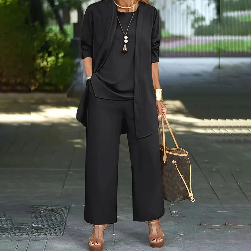 Black three-piece set with open cardigan over short-sleeve top and wide-leg trousers