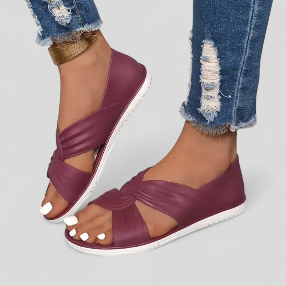 Dark red orthopedic sandals with open toe and knotted crossover strap, white sole