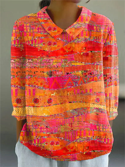 Vibrant mosaic blouse with V-neck, long sleeves, multicolor geometric print