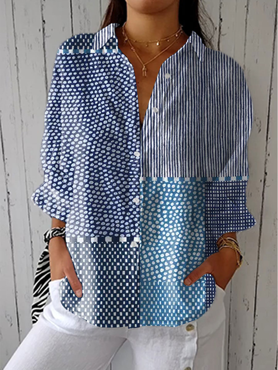 Multicolor patchwork blouse with blue striped and dotted panels, long sleeves, V-neck