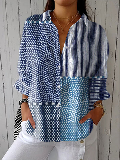Multicolor patchwork blouse with blue striped and dotted panels, long sleeves, V-neck