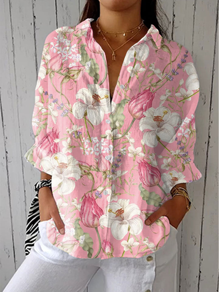 Pink floral blouse with V-neck button front and long puff sleeves