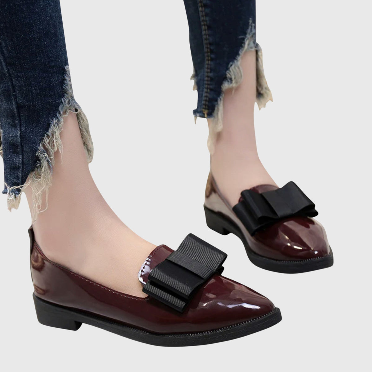 Burgundy glossy loafer with wide black strap and cushioned sole