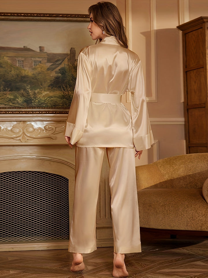 Women’s satin robe and pajama set in ivory, belted robe with flared sleeves (back view)