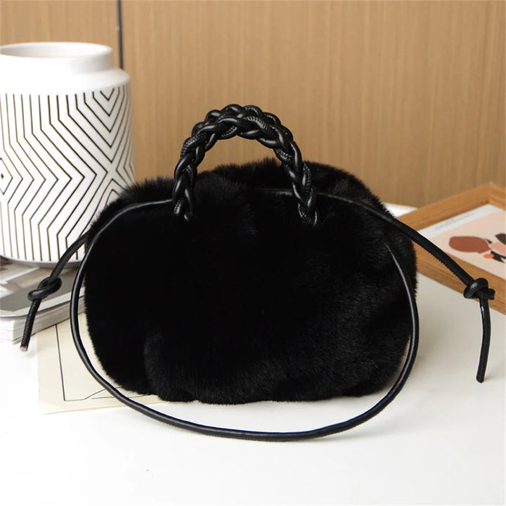 Black plush pumpkin shoulder tote with braided handle and long rope strap