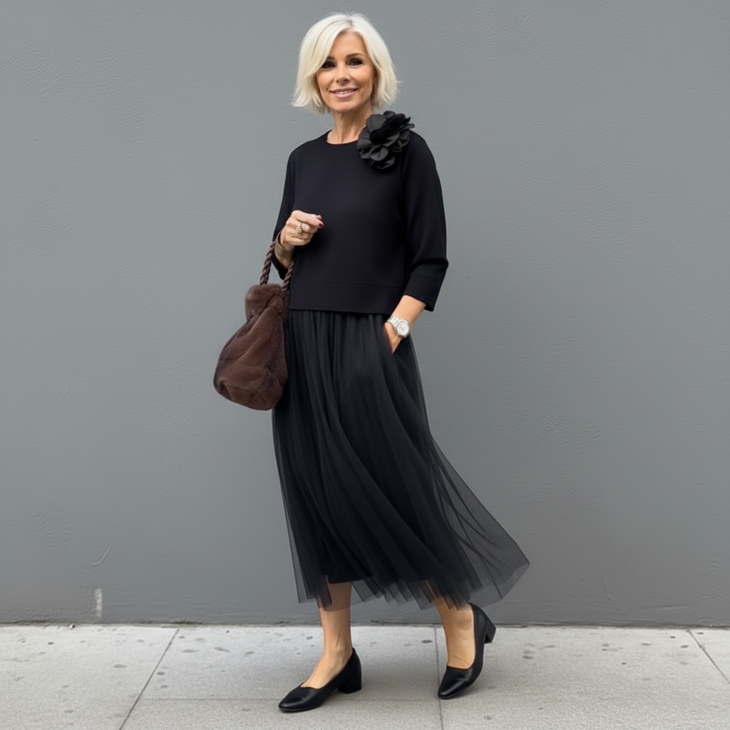 Black knit dress set with shoulder flower detail and pleated tulle midi skirt