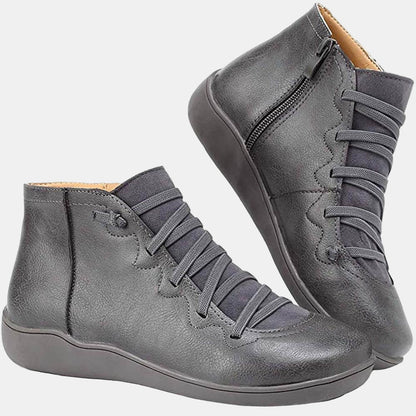 Gray lace-up ankle boots with side zipper, gray laces, and flat rubber sole
