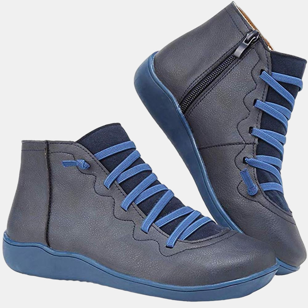 Blue lace-up ankle boots with side zipper, blue laces, and flat rubber sole