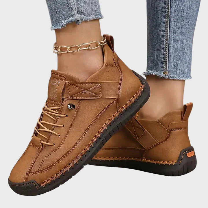 Orthopedic sneakers in brown with lace-up front, ankle strap, and stitched rubber sole