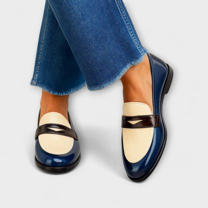 Contrast loafers with navy gloss finish, cream vamp and brown strap, round toe