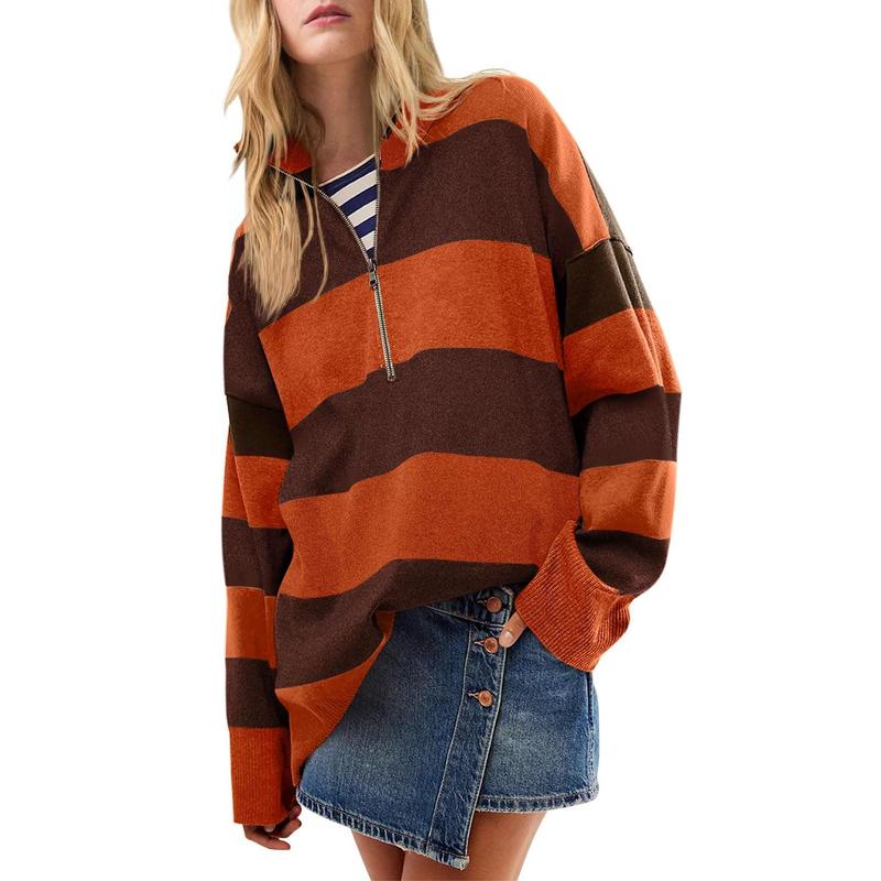 Oversized turtleneck sweater with orange-and-brown striped half-zip