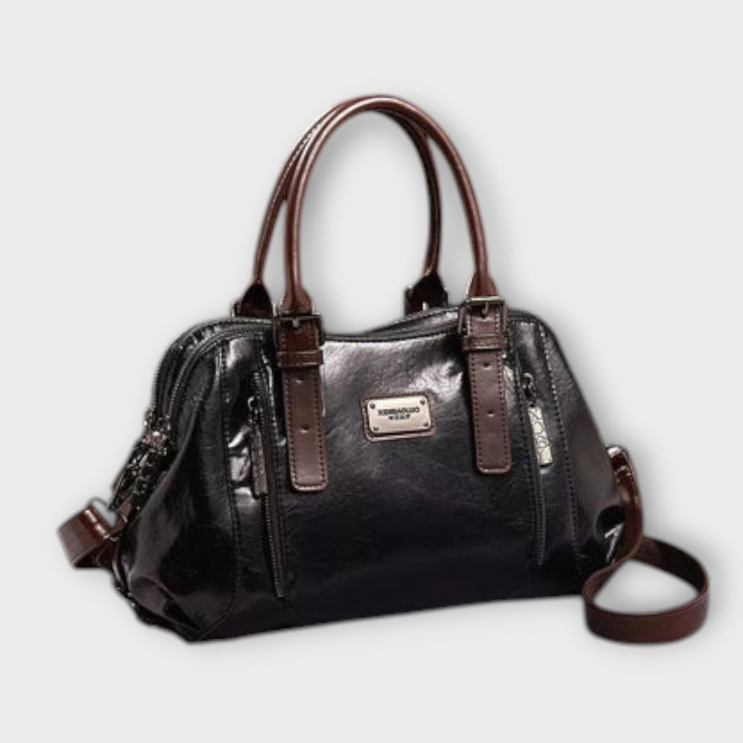 Vintage leather-look shoulder bag in dark/black with top handles and crossbody strap