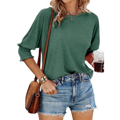 Green lightweight short-sleeve blouse with gathered cuffs and relaxed fit