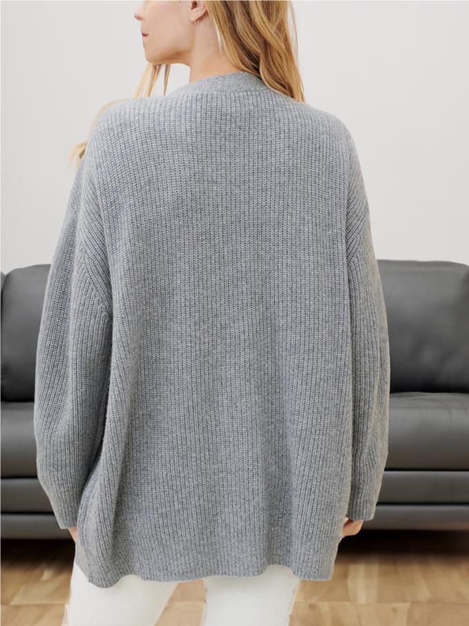 Gray knit cardigan back view with relaxed cocoon shape, long sleeves, ribbed texture.