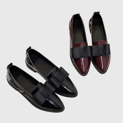 Two-tone set of black and burgundy patent loafers with wide black strap