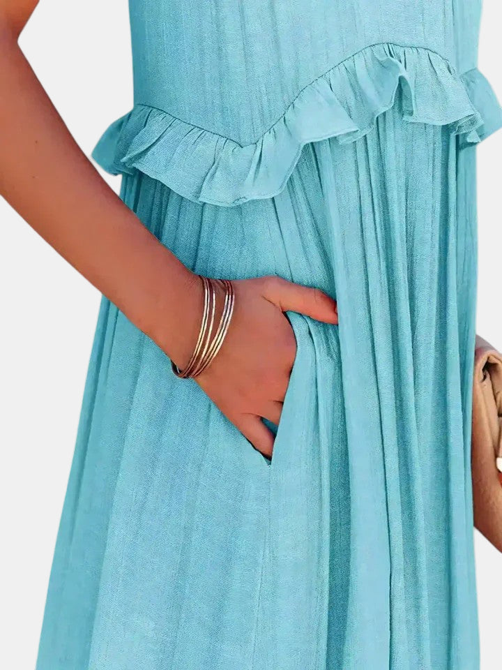 Light blue long dress with sleeveless ruffled tiered bodice and gathered skirt panel