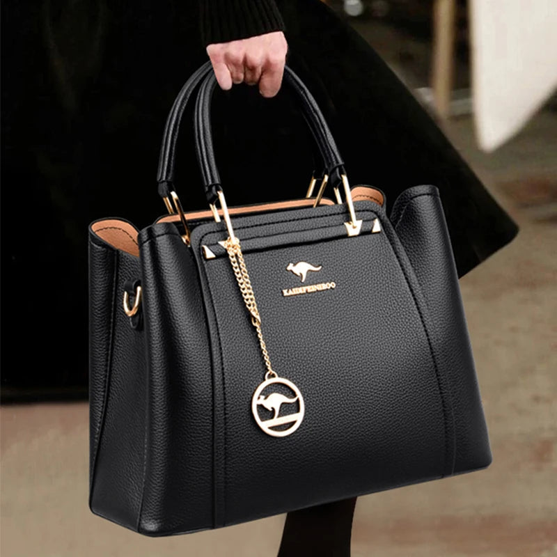 Vaeni women’s structured handbag, black pebbled leather, top handles and crossbody strap
