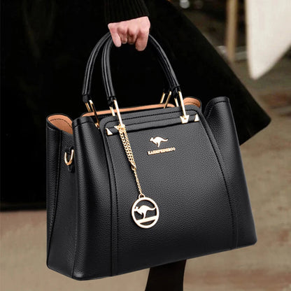 Vaeni women’s structured handbag, black pebbled leather, top handles and crossbody strap