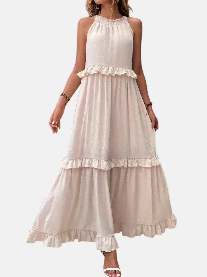Cream sleeveless long dress with halter neckline and tiered ruffle skirt layers