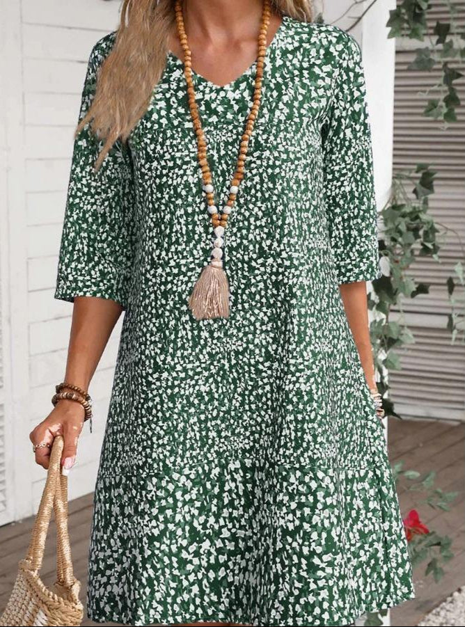 Green boho bloom dress with white speckle floral print, tiered hem, 3/4 sleeves