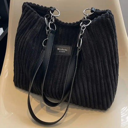 Large capacity corduroy tote bag in dark black with top zipper and shoulder strap