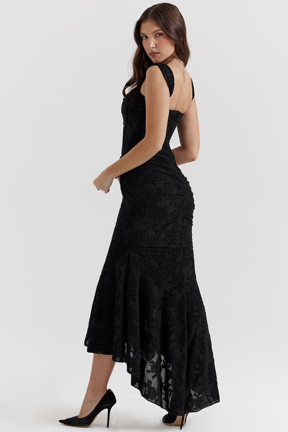 Black evening dress with ruched corset bodice, flared mermaid skirt, sleeveless