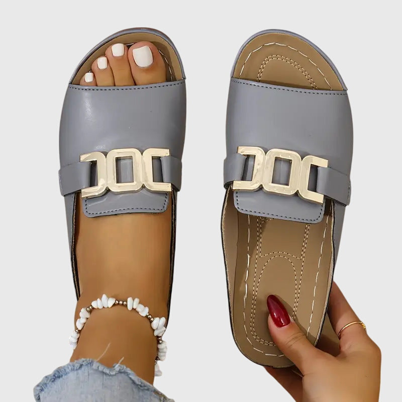 Gray comfy buckle sandals with gold-tone double bar buckle, open-toe slide