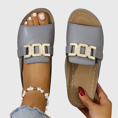 Gray comfy buckle sandals with gold-tone double bar buckle, open-toe slide