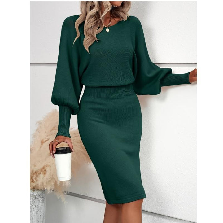 Dark green sweater dress with lantern sleeves, crew neck, fitted waist and pencil midi skirt