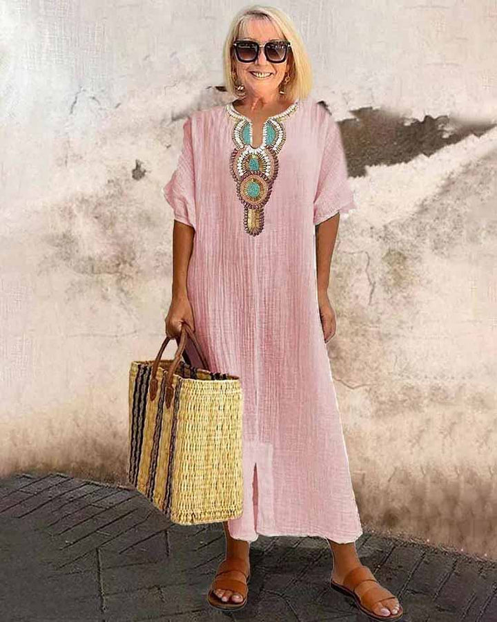 Pink embroidered midi dress with short sleeves and central ornamental placket