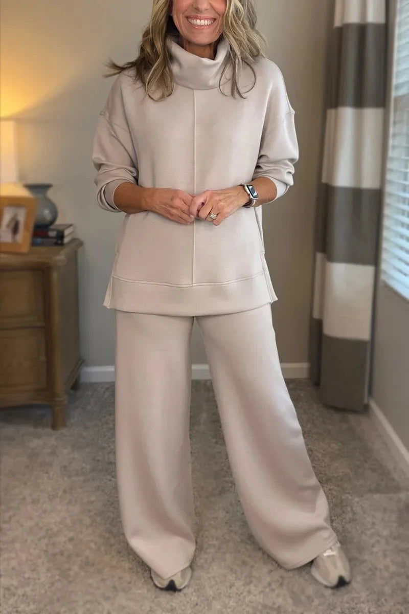 Cream coordinated zip-front hoodie top and wide-leg pants set.
