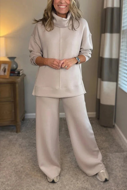 Cream coordinated zip-front hoodie top and wide-leg pants set.