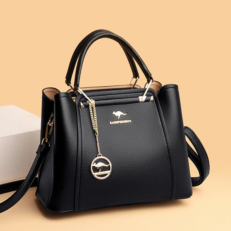 Vaeni women’s structured handbag, black pebbled leather, crossbody strap and logo front