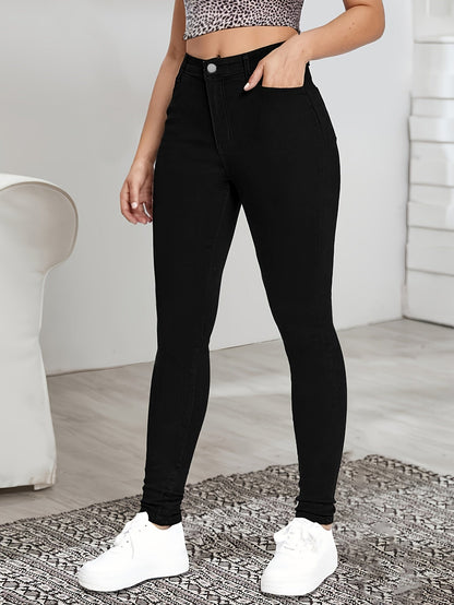 Black high-waist skinny jeans with button-and-zip front and belt loops