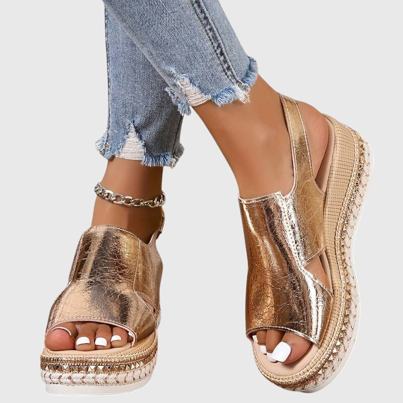 Gold metallic orthopedic sandals with wide toe strap, chain ankle detail, platform sole