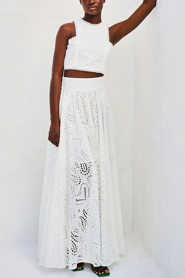 White embroidered sleeveless crop top and high-waist maxi skirt set with eyelet pattern