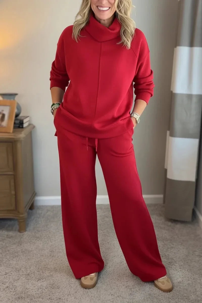 Red coordinated zip-front hoodie top and wide-leg pants set.
