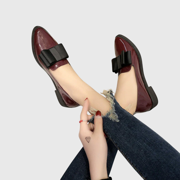 Burgundy patent loafer with black wide strap and low block heel