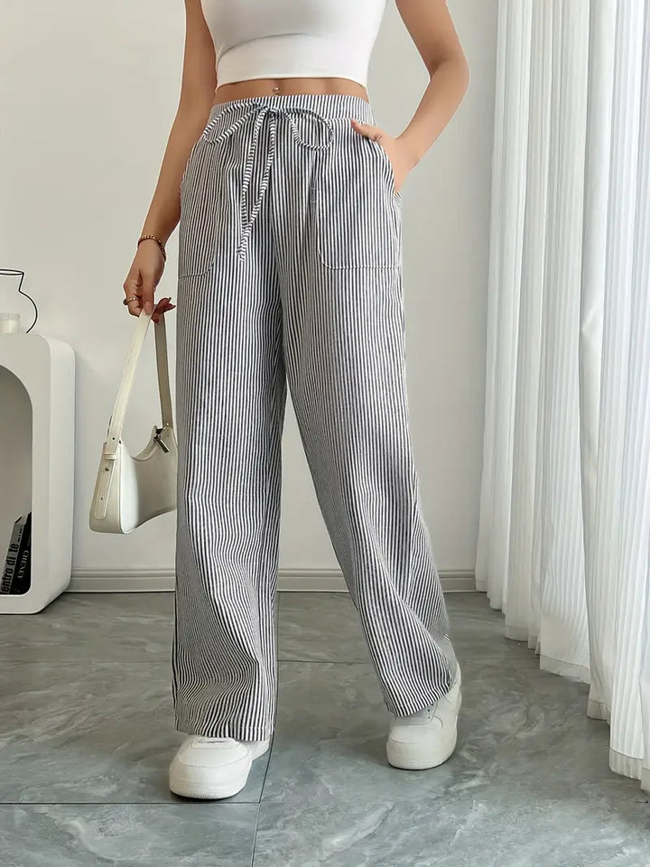 Grey striped wide-leg pants with drawstring waist and side pockets