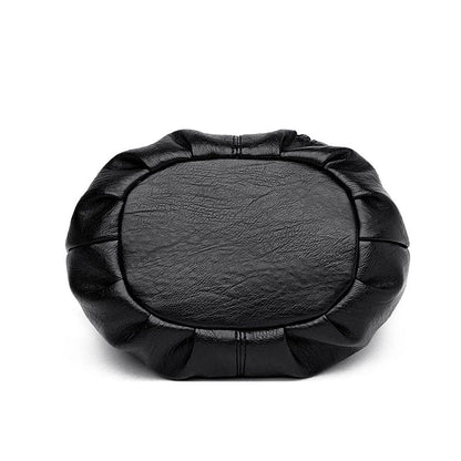 Black multi-layer handbag with oval front panel and padded stitched edges