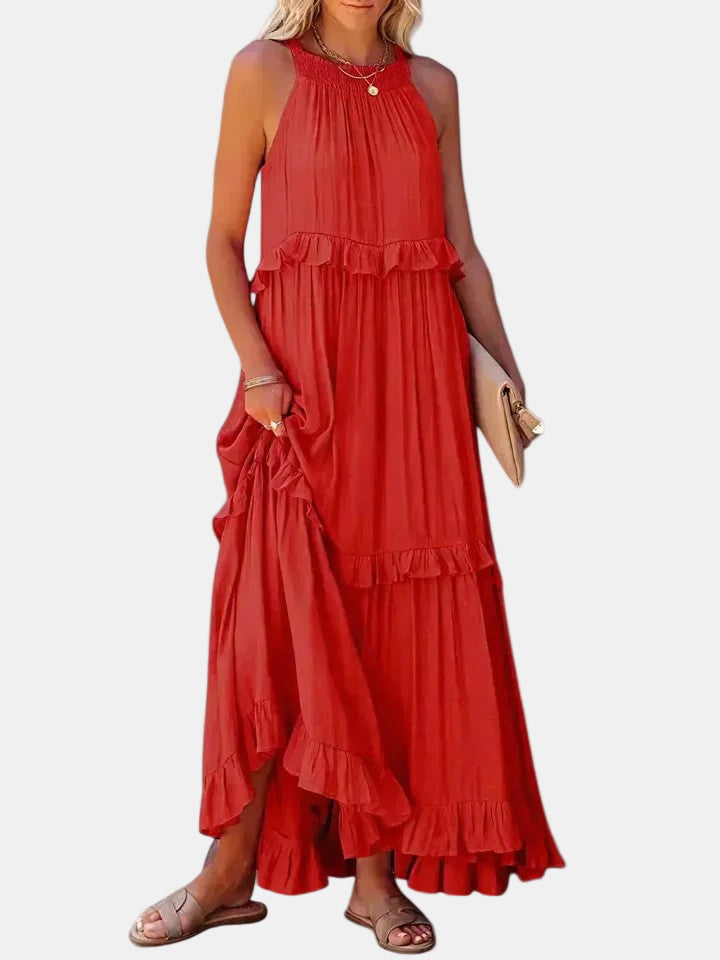 Red sleeveless tiered maxi dress with ruffled halter neckline and layered hem