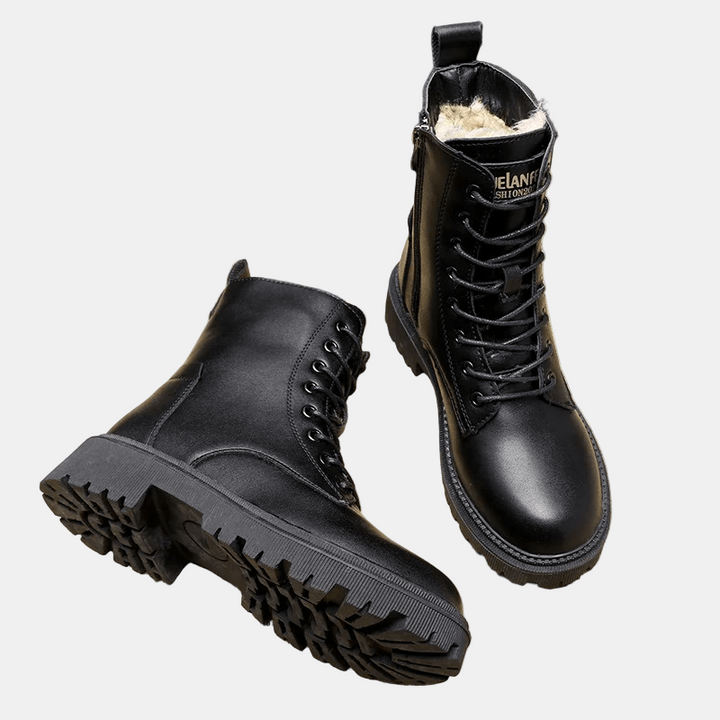 Black lace-up ankle boots with chunky lug outsole and side opening