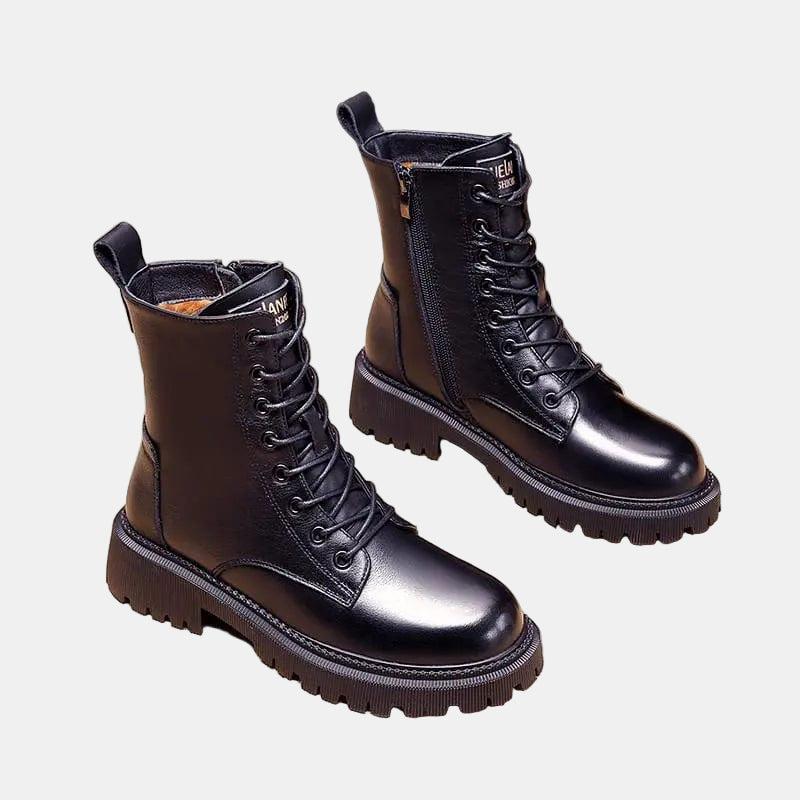 Dark ankle boots with lace-up front, side zip, and chunky lug sole