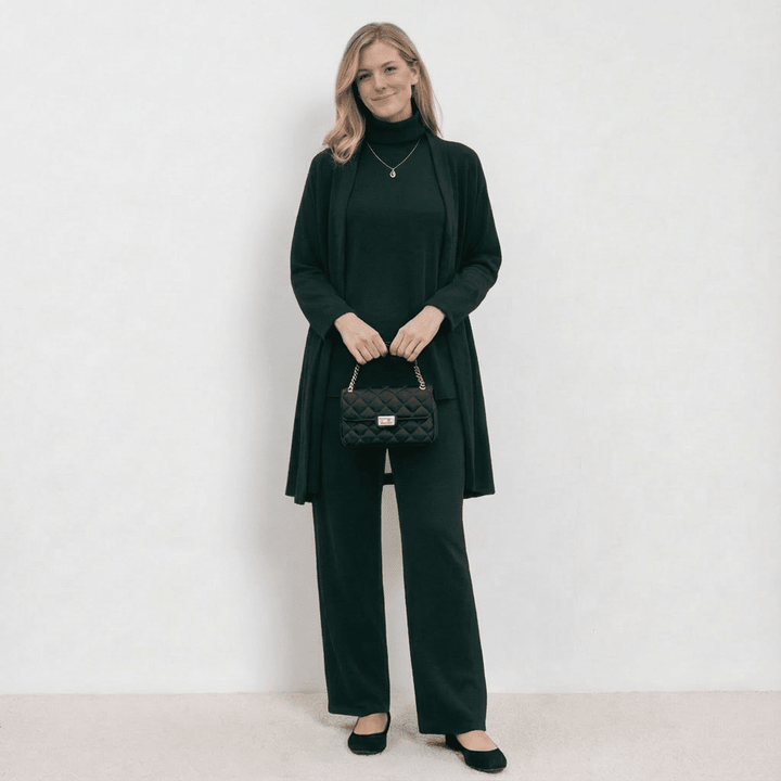 Green knit cardigan, turtleneck top and wide-leg trousers set.