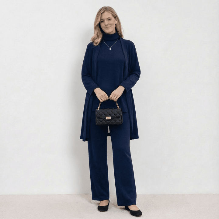 Blue knit cardigan, turtleneck top and wide-leg trousers set.