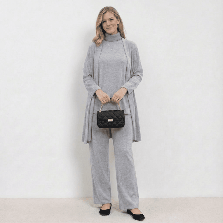 Light grey knit cardigan, turtleneck top and wide-leg trousers set.