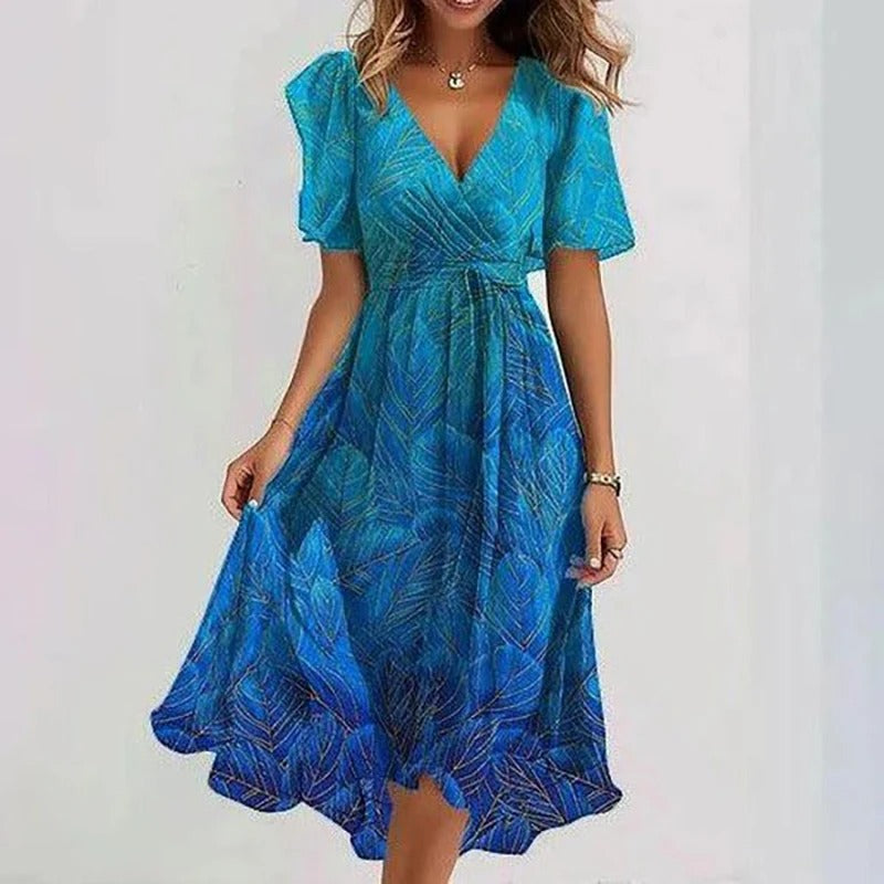 Bright blue leaf print midi dress with V-neck and short puff sleeves