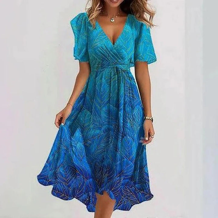 Bright blue leaf print midi dress with V-neck and short puff sleeves