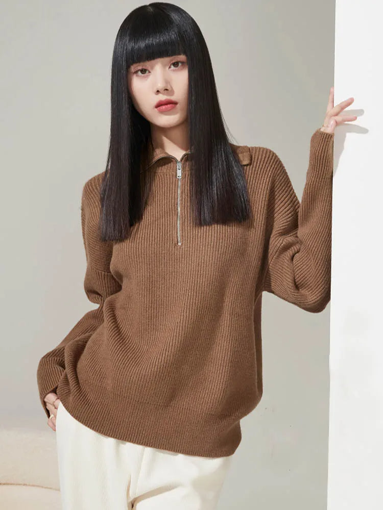 Tan half-zip ribbed knit sweater with short collar and long sleeves
